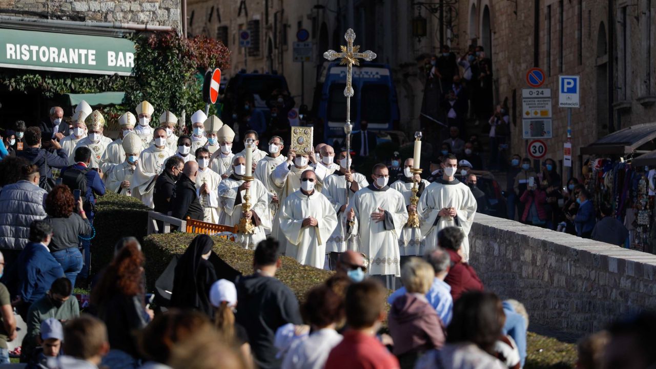A procession walks through the streets of Assisi, Italy, prior to the beatification ceremony of 15-year-old Carlo Acutis.