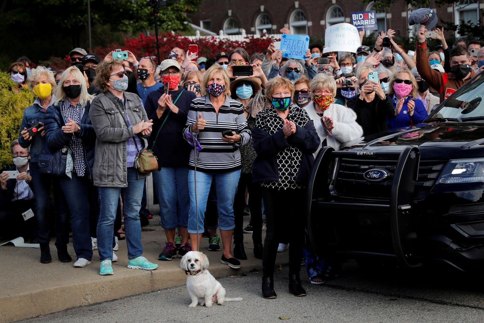 Supporters cheer for Biden as he arrives by train in Greensburg, Pennsylvania, on September 30.