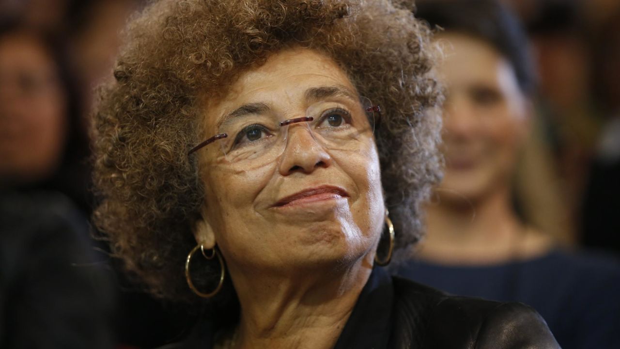 US political activist Angela Davis takes part in a meeting held in Saint-Denis, near Paris, to celebrate the 10th anniversary of anti-racism movement "Les Indigenes de la République", on May 8, 2015. AFP PHOTO / THOMAS SAMSON (Photo credit should read THOMAS SAMSON/AFP via Getty Images)