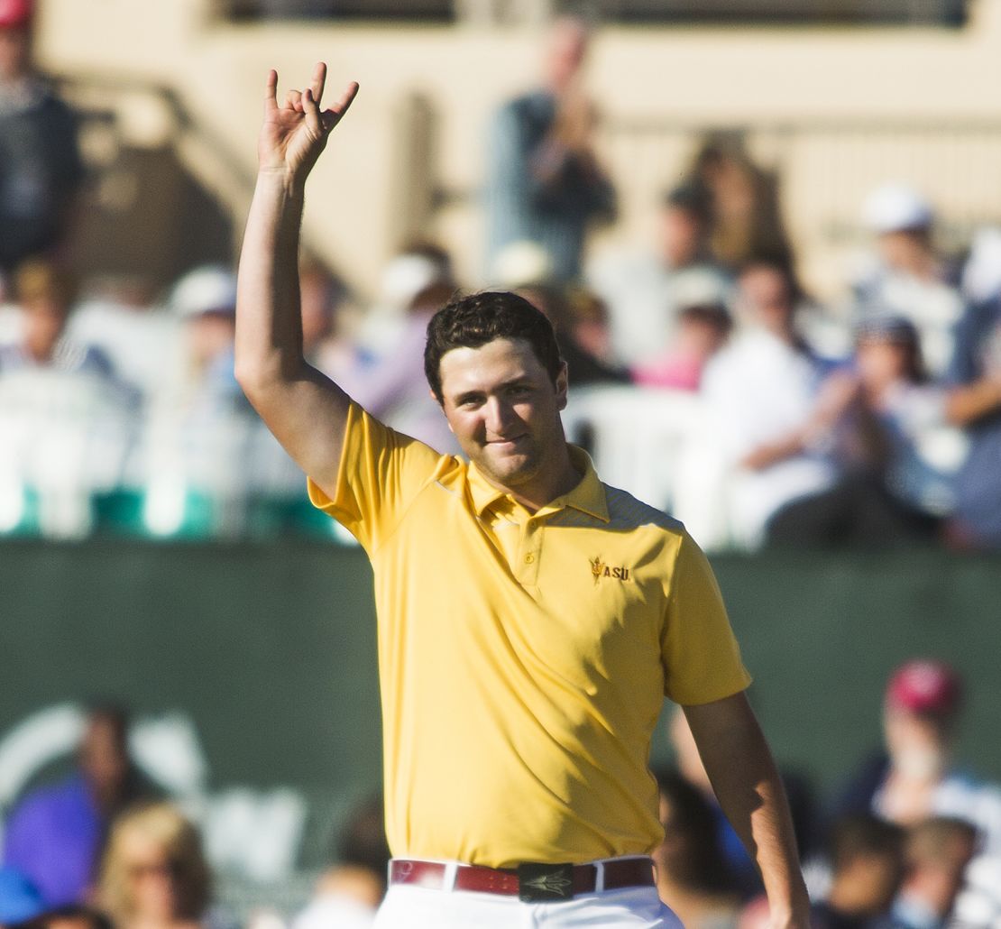 Rahm gives the pitchfork salute after finishing his round at 12-under par. 