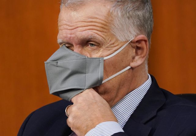 US Sen. Thom Tillis, a Republican from North Carolina who recently tested positive for Covid-19, puts his hand under his face mask while Barrett testifies on October 13. Tillis announced during the hearing <a  target="_blank">that he's participating in two studies.</a> He said he enrolled in the studies during his time in quarantine. "Because this is being aired, I hope anyone who has recovered from Covid will do their part to try heal this country from the health challenges that Covid has presented us," Tillis said. "I intend to do my part."