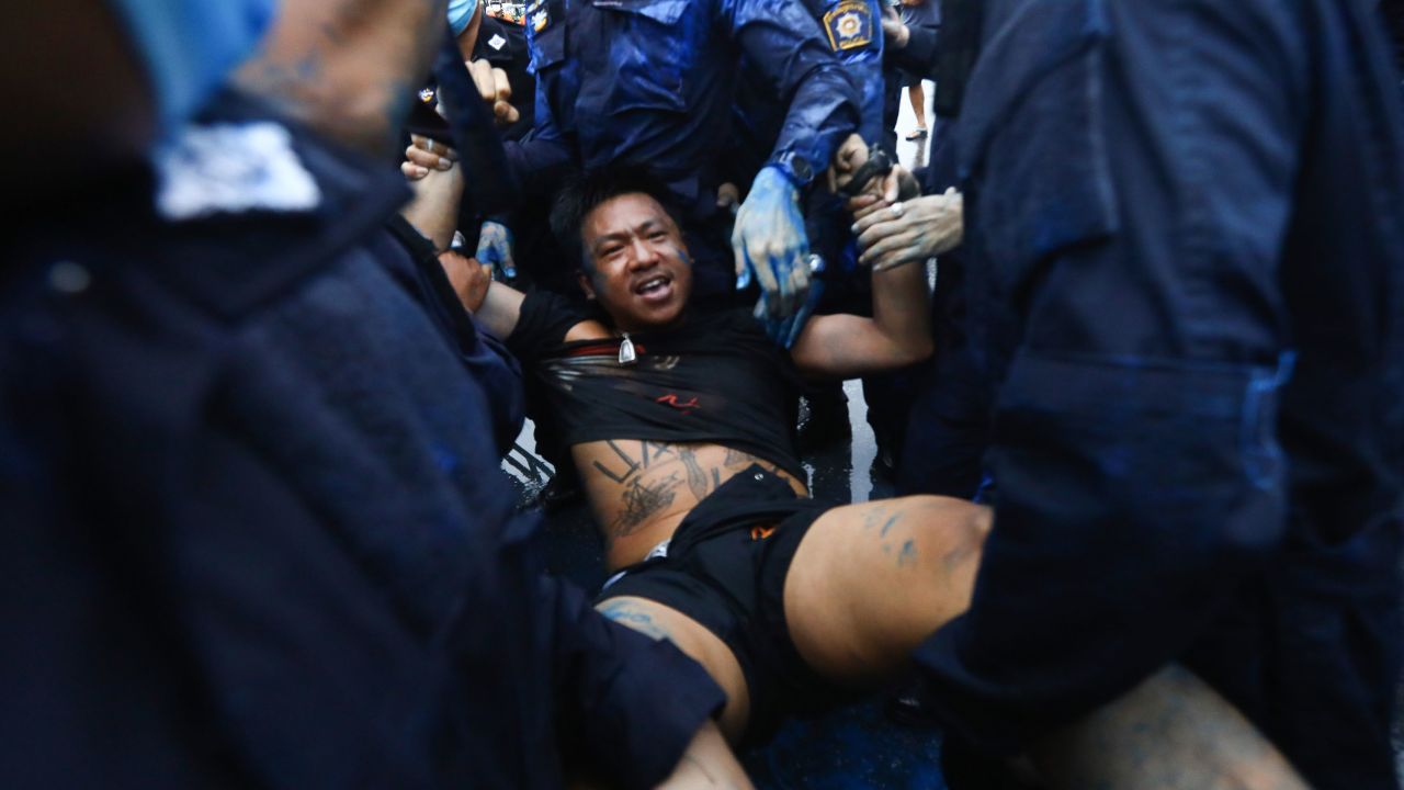 Police arrest activist Jatupat Boonpattararaksa near in Bangkok, on Tuesday.
