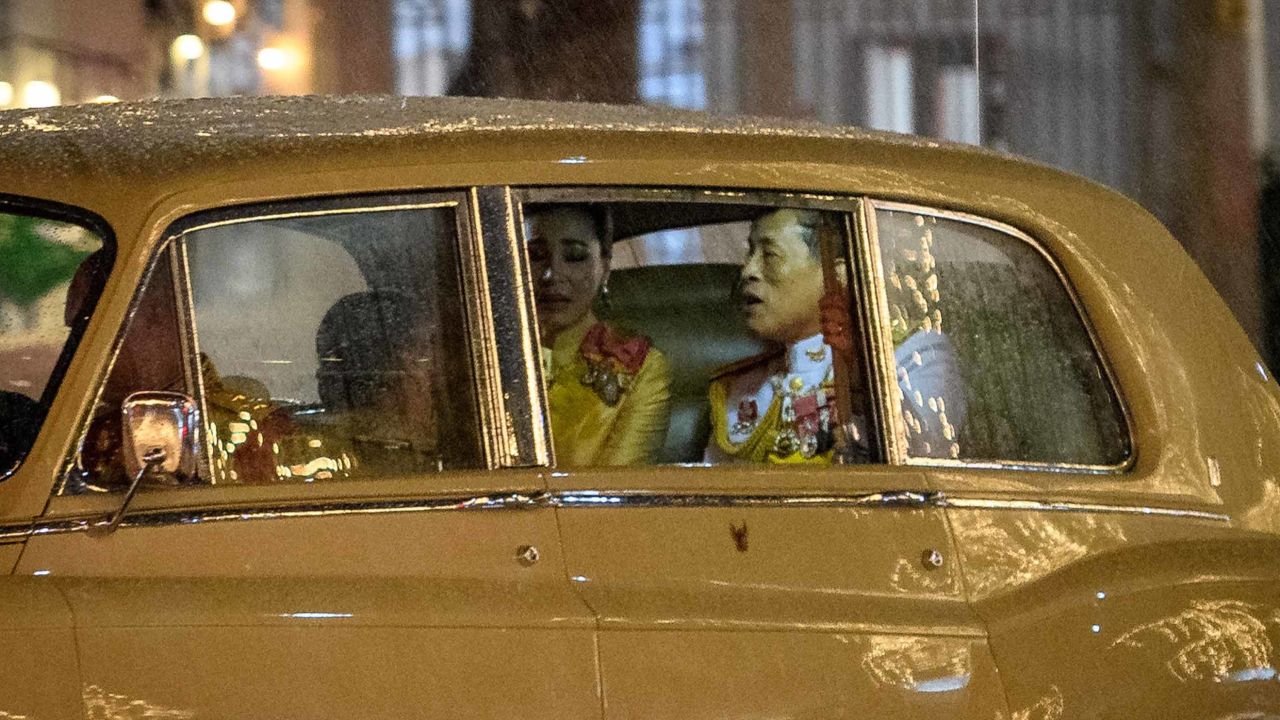 Thailand's King Maha Vajiralongkorn, right, rides with Queen Suthida, center, and Princess Bajrakitiyabha, as they leave the Grand Palace in Bangkok following a ceremony marking the fourth anniversary of the late King Bhumibol Adulyadej on Tuesday.