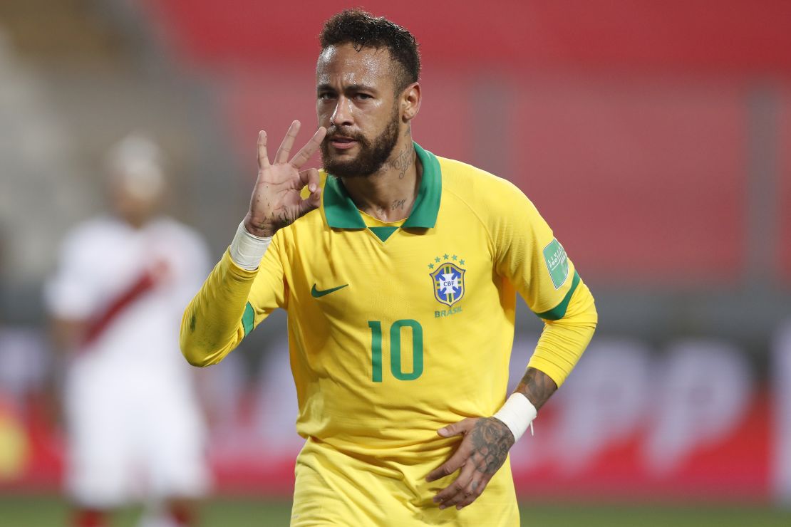 Neymar celebrates after completing his hat-trick against Peru.