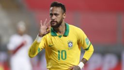LIMA, PERU - OCTOBER 13: Neymar Jr. of Brazil celebrates after scoring the fourth goal of his team during a match between Peru and Brazil as part of South American Qualifiers for Qatar 2022 at Estadio Nacional de Lima on October 13, 2020 in Lima, Peru. (Photo by Paolo Aguilar-Pool/Getty Images)