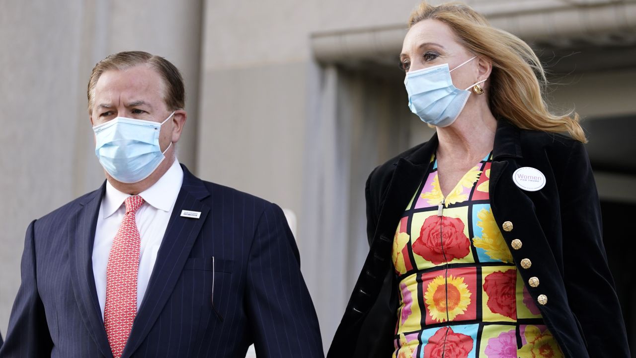 Mark and Patricia McCloskey leave court after pleading not guilty on Wednesday.