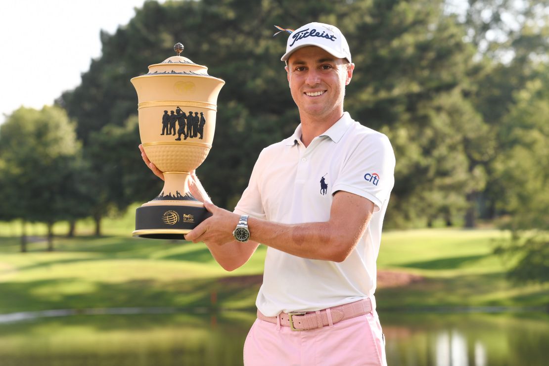 Thomas holds the trophy after winning the World Golf Championships-FedEx St. Jude Invitational.