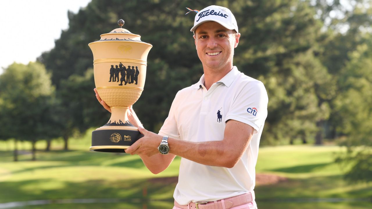 Thomas holds the trophy after winning the World Golf Championships-FedEx St. Jude Invitational.