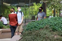 Students are required to wear masks on campus, even outside buildings.