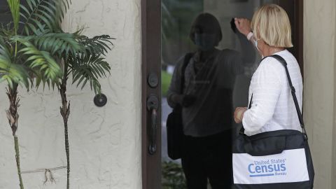 A census taker knocks on the door of a residence in August in Winter Park, Fla. Census workers visited households that hadn't yet responded to the 2020 census.