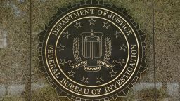 The FBI seal is seen outside the headquarters building in Washington, DC on July 5, 2016. - The FBI said Tuesday it will not recommend charges over Hillary Clinton's use of a private email server as secretary of state, but said she had been "extremely careless" in her handling of top secret data. The decision not to recommend prosecution will come as a huge relief for the presumptive Democratic nominee whose White House campaign has been dogged by the months-long probe. (Photo by YURI GRIPAS / AFP)        (Photo credit should read YURI GRIPAS/AFP via Getty Images)