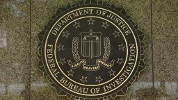The FBI seal is seen outside the headquarters building in Washington, DC on July 5, 2016. - The FBI said Tuesday it will not recommend charges over Hillary Clinton's use of a private email server as secretary of state, but said she had been "extremely careless" in her handling of top secret data. The decision not to recommend prosecution will come as a huge relief for the presumptive Democratic nominee whose White House campaign has been dogged by the months-long probe. (Photo by YURI GRIPAS / AFP)        (Photo credit should read YURI GRIPAS/AFP via Getty Images)