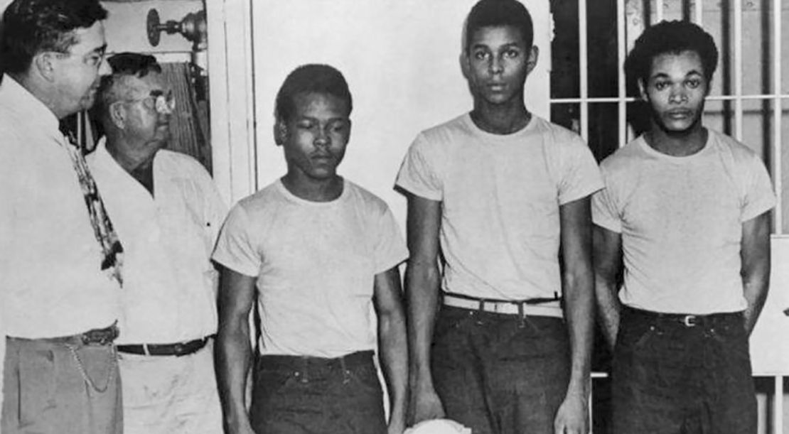 Lake County Sheriff Willis McCall, far left, and an unidentified man stand next to Walter Irvin, Samuel Shepherd and Charles Greenlee, from left, in Florida. The three men along with a fourth were charged with rape in 1949.