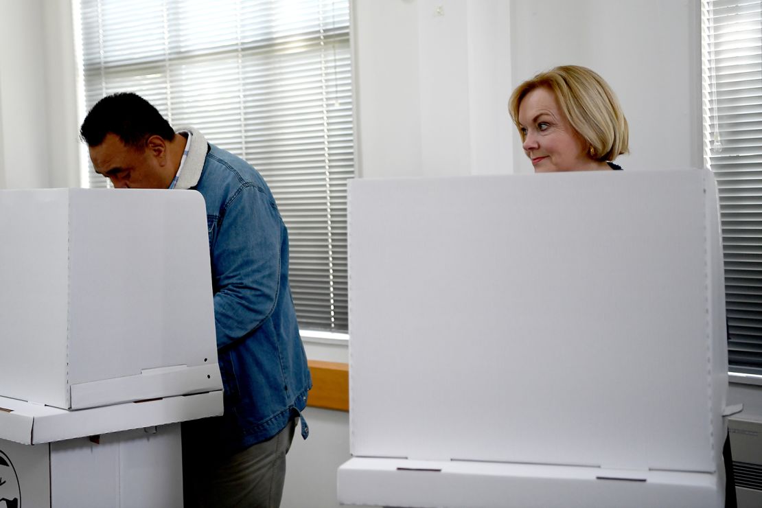 National Party leader Judith Collins and husband David Wong-Tung vote on October 4, 2020, in Auckland, New Zealand. 