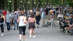 NEW YORK, NEW YORK - SEPTEMBER 26: People with and without masks avoid social distancing while walking in Central Park as the city continues Phase 4 of re-opening following restrictions imposed to slow the spread of coronavirus on September 26, 2020 in New York City. The fourth phase allows outdoor arts and entertainment, sporting events without fans and media production. (Photo by Alexi Rosenfeld/Getty Images)