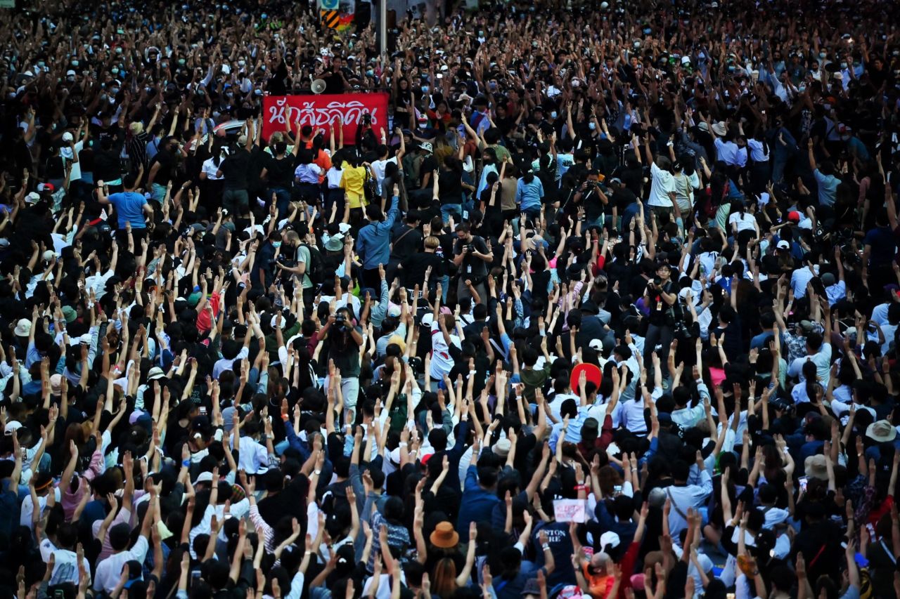 Protesters hold up the three-finger salute en masse on October 15.