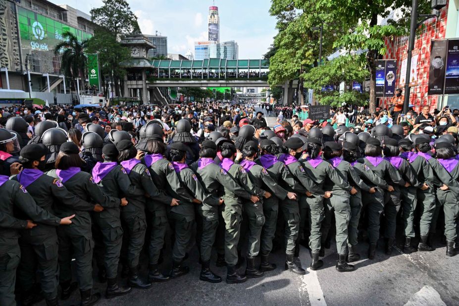 Police line up in front of pro-democracy protesters gathering for a rally on October 15.