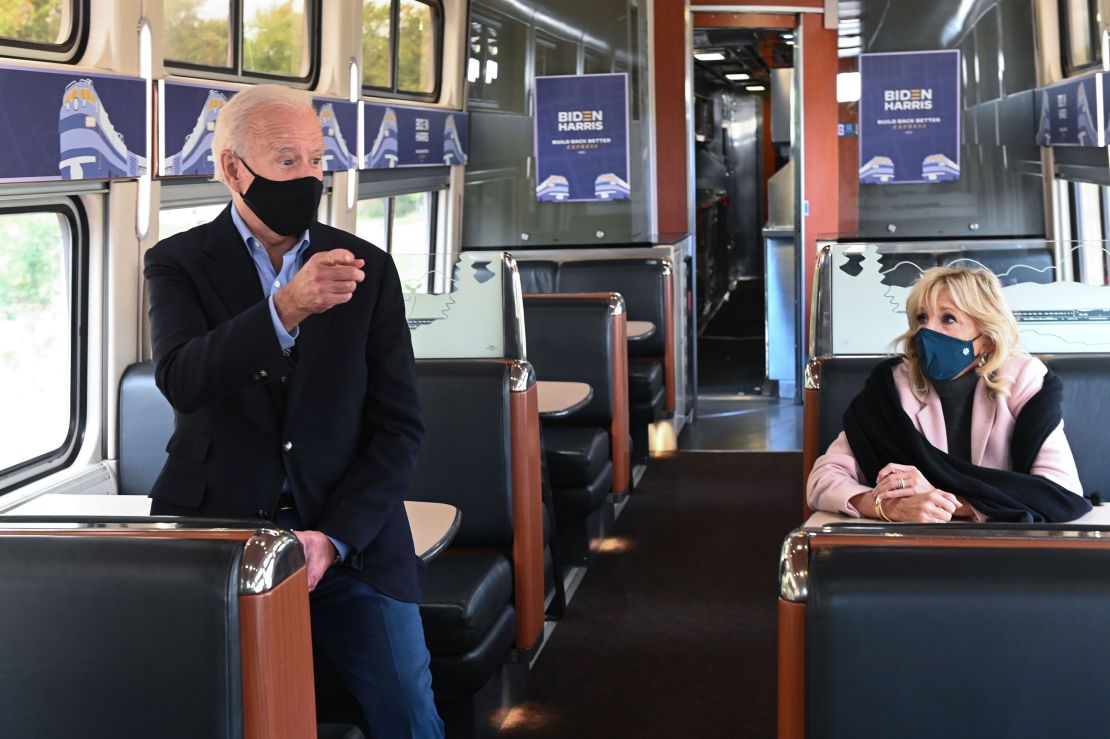 Democratic presidential nominee Joe Biden, with Jill Biden, speaks to voters as he rides a train approaching the Alliance Train Station in Alliance, Ohio.