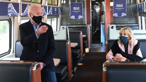 Democratic presidential nominee Joe Biden, with Jill Biden, speaks to voters as he rides a train approaching the Alliance Train Station in Alliance, Ohio.