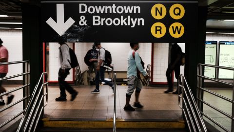 People walk through a nearly empty Manhattan subway station on August 26, 2020 in New York City.