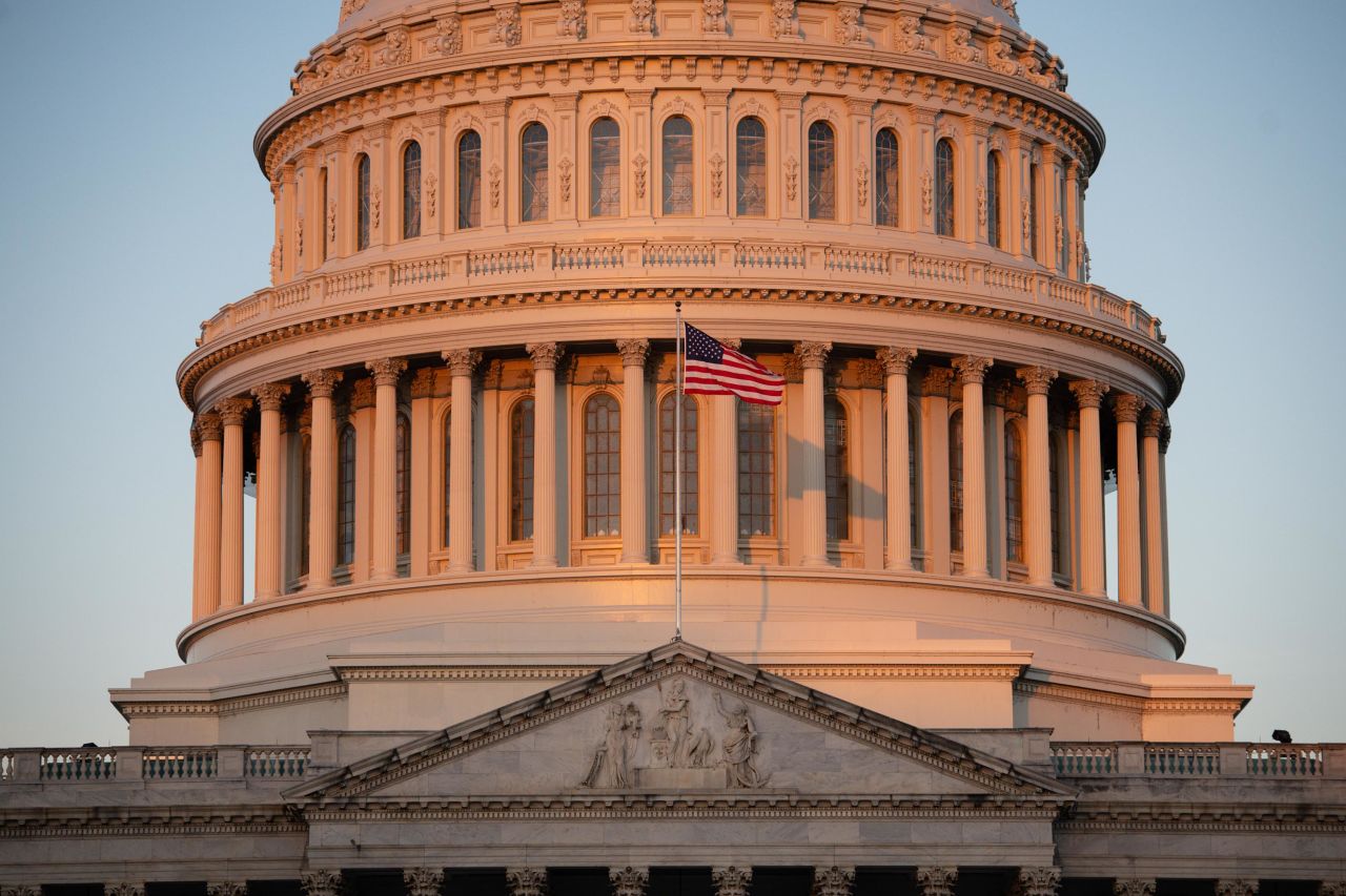 An American flag flies outside the US Capitol on October 15.