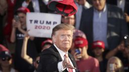 President Donald Trump tosses a hat into the crowd as he arrives for a 'Make America Great Again' campaign rally at Williamsport Regional Airport, May 20, 2019 in Pennsylvania.
