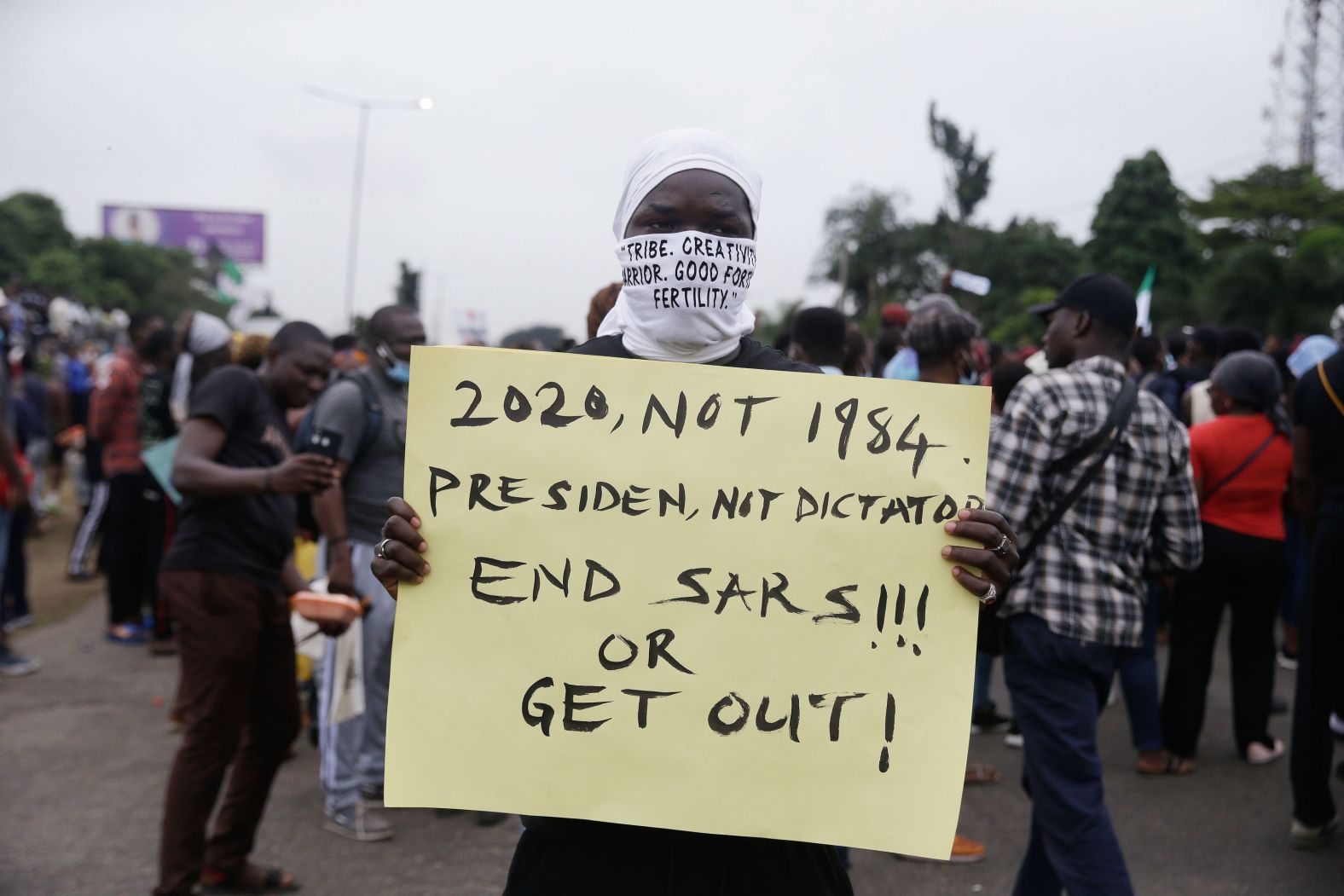A protester holds a sign during a rally in Lagos on October 14.