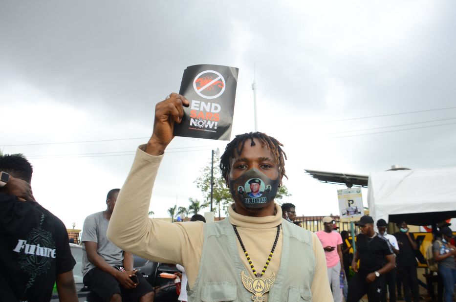 A protester displays a placard in Ikeja on October 13.