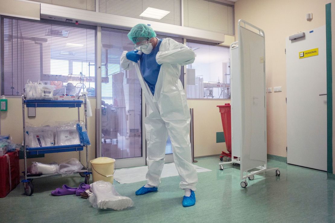 A healthcare worker dons PPE at a hospital in Prague on Wednesday.