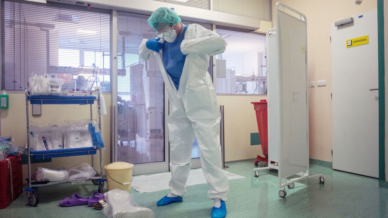A healthcare worker dons PPE at a hospital in Prague on Wednesday.