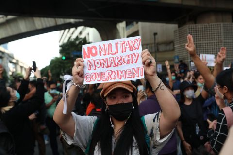 A pro-democracy protester holds up a sign during a rally on October 15.