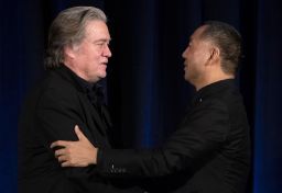 Former White House Chief Strategist Steve Bannon (L) greets fugitive Chinese billionaire Guo Wengui before introducing him at a news conference on November 20, 2018 in New York.