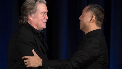 Former White House Chief Strategist Steve Bannon (L) greets fugitive Chinese billionaire Guo Wengui before introducing him at a news conference on November 20, 2018 in New York.