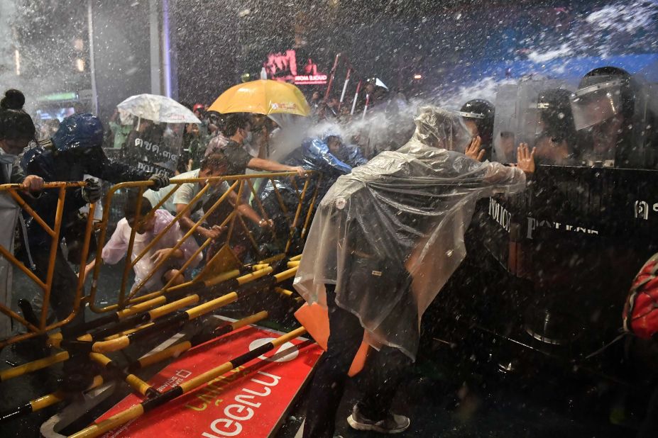 Police fire water cannons at pro-democracy protesters during an anti-government rally in Bangkok on Friday, October 16.