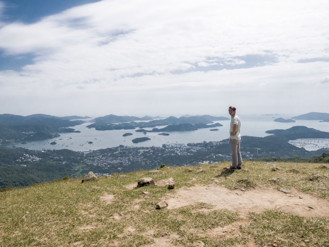 Felix Yeung, a country parks officer, poses for a photo at a viewpoint in Ma On Shan Country Park, Hong Kong, on October 16, 2020.