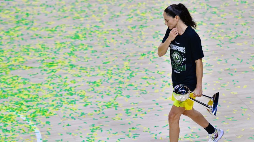 PALMETTO, FLORIDA - OCTOBER 06: Sue Bird #10 of the Seattle Storm walks through the confetti holding the WNBA Championship after defeating the Las Vegas Aces 92-59 in Game 3 of the WNBA Finals at Feld Entertainment Center on October 06, 2020 in Palmetto, Florida. NOTE TO USER: User expressly acknowledges and agrees that, by downloading and or using this photograph, User is consenting to the terms and conditions of the Getty Images License Agreement. (Photo by Julio Aguilar/Getty Images)