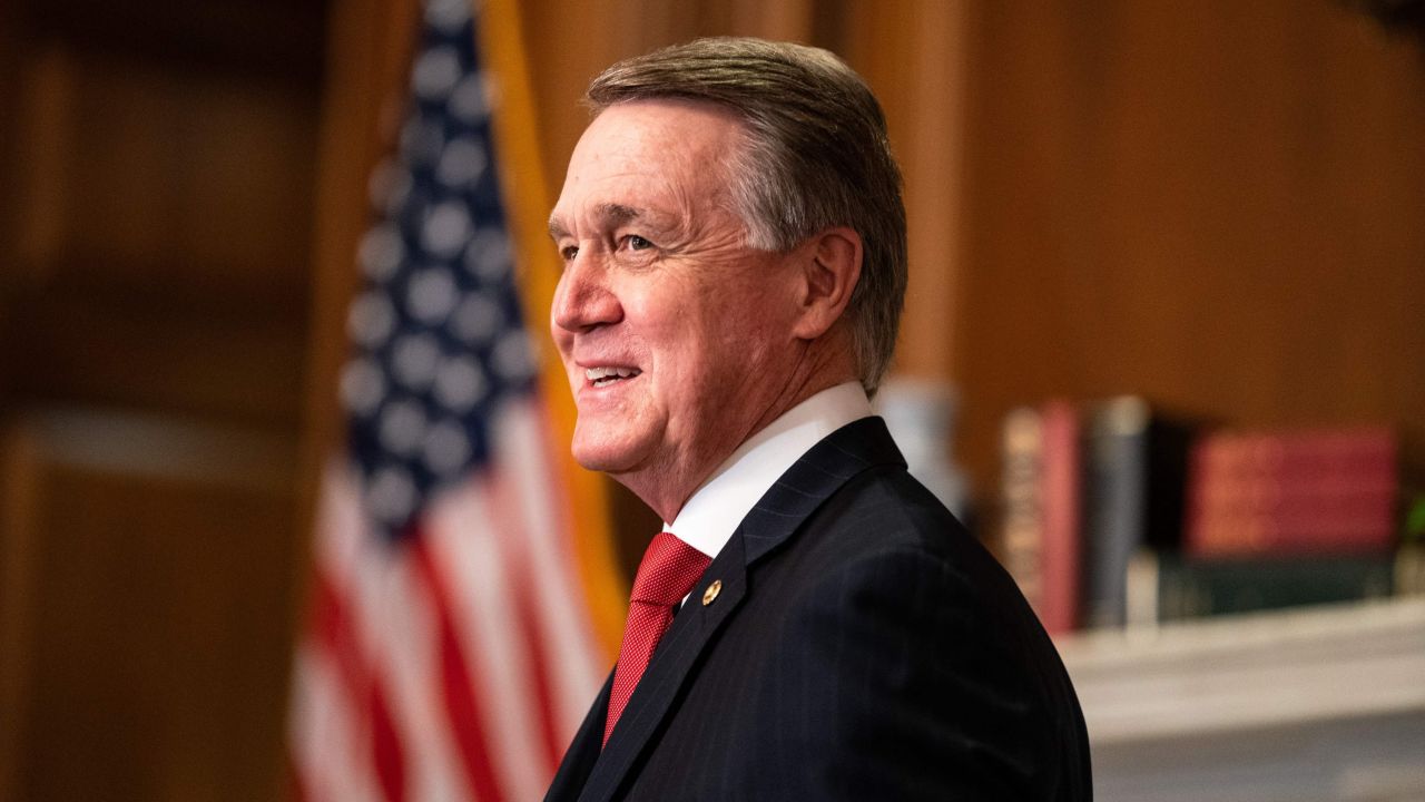 Senator David Perdue, R-GA, poses for a photo with Judge Amy Coney Barrett, President Donald Trumps nominee for Supreme Court, before a meeting at the US Capitol on September 30, 2020, in Washington, DC. (Photo by Anna Moneymaker / POOL / AFP) (Photo by ANNA MONEYMAKER/POOL/AFP via Getty Images)