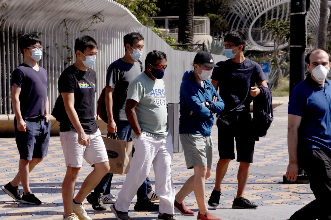 Pedestrians wear masks while visiting Santa Monica on September 29.