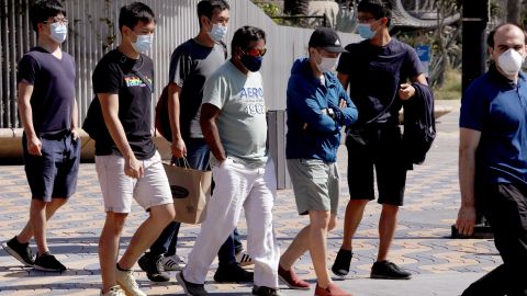 Pedestrians wear masks while visiting Santa Monica on September 29.