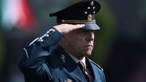 Mexico's Defense Secretary Gen. Salvador Cienfuegos Zepeda salutes soldiers at the Number 1 military camp in Mexico City.