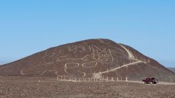 This handout photo provided by Peru's Ministry of Culture-Nasca-Palpa shows the figure of a feline on a hillside in Nazca, Peru, Friday, Oct. 9, 2020. Peruvian archaeologists carrying out maintenance work in the renowned Nazca Lines geoglyphs site have discovered the figure of a feline which was barely discernible and almost completely erased, the Ministry of Culture reported on Friday, Oct. 16.  (Jhony Islas/Peru's Ministry of Culture - Nasca-Palpa via AP)