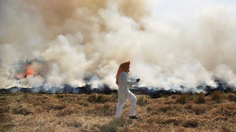 A farmer burns straw stubble after harvesting a paddy crop on October 17 in Amritsar, India.