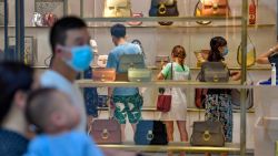 SANYA, CHINA - OCTOBER 02: Customers purchase bags at a duty-free shopping centre on the second day of the National Day and Mid-Autumn Festival holiday on October 2, 2020 in Sanya, Hainan Province of China. (Photo by Luo Yunfei/China News Service via Getty Images)