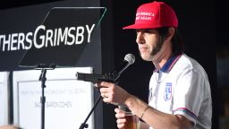Actor Sacha Baron Cohen mocks support for Donald Trump while speaking to the audience on arrival for the premiere of the film 'The Brothers Grimsby' in Los Angeles, California on March 3, 2016. / AFP / FREDERIC J. BROWN        (Photo credit should read FREDERIC J. BROWN/AFP via Getty Images)
