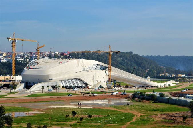 <strong>The Grand Theatre of Rabat, Rabat, Morocco -- </strong>One of the last designs by Zaha Hadid that is still to be completed, the Grand Theatre of Rabat has all the panache one expects from the "queen of the curve," who died in 2016. Sitting on a 55,000 square meter site and featuring an 1,800-seat theater and 7,000-person amphitheater, the center's fluid design was i<a target="_blank" target="_blank">nspired by the Bouregreg River that runs alongside it</a>.<br /><br />Inside the theater, Hadid and her successor Patrik Schumacher take Moroccan muqarnas -- ornamental vaulted ceilings in Islamic architecture -- and translate them with a contemporary eye, creating geometry akin to <a target="_blank" target="_blank">desert rose crystals</a>. Situated between the ancient cities of Rabat and Salé, the theater has been a decade in the making but is receiving its final touches.