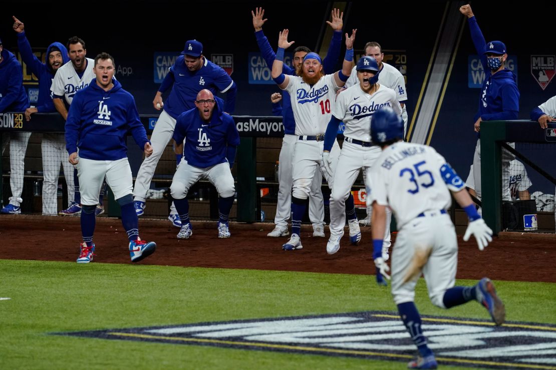 Cody Bellinger of the LA Dodgers celebrates with his teammates after hitting a home run in the seventh inning during Game 7 of the NLCS against the Atlanta Braves.
