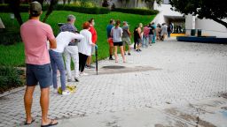 Voters wait in line to cast their early ballots at Miami Beach City Hall in Miami Beach, Florida on October 19, 2020.