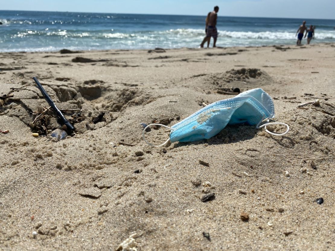 PPE waste, including disposable masks, found on a beach in New Jersey.