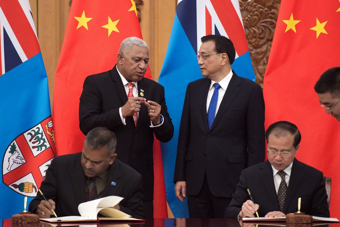 Fiji's Prime Minister Josaia Voreqe "Frank" Bainimarama talks with Chinese Premier Li Keqiang during a signing ceremony at the Great Hall of the People in Beijing on May 16, 2017.