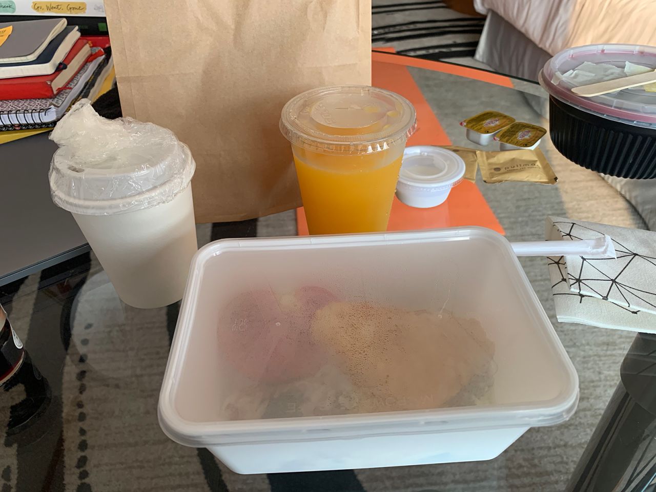 <strong>Eat it up:</strong> Meals and utensils were delivered to Tsui's room in individual plastic containers.